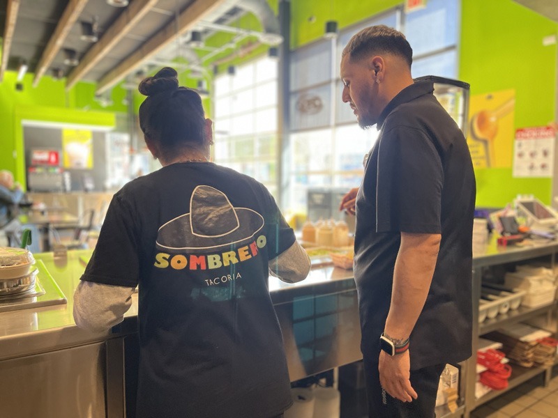 Sombrero Tacoria Franchise Employees Help A Customer